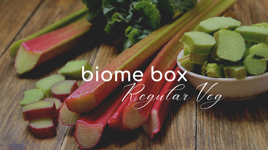 Chopped rhubarb stalks on a wooden board – Biome Box staple no-dig veg