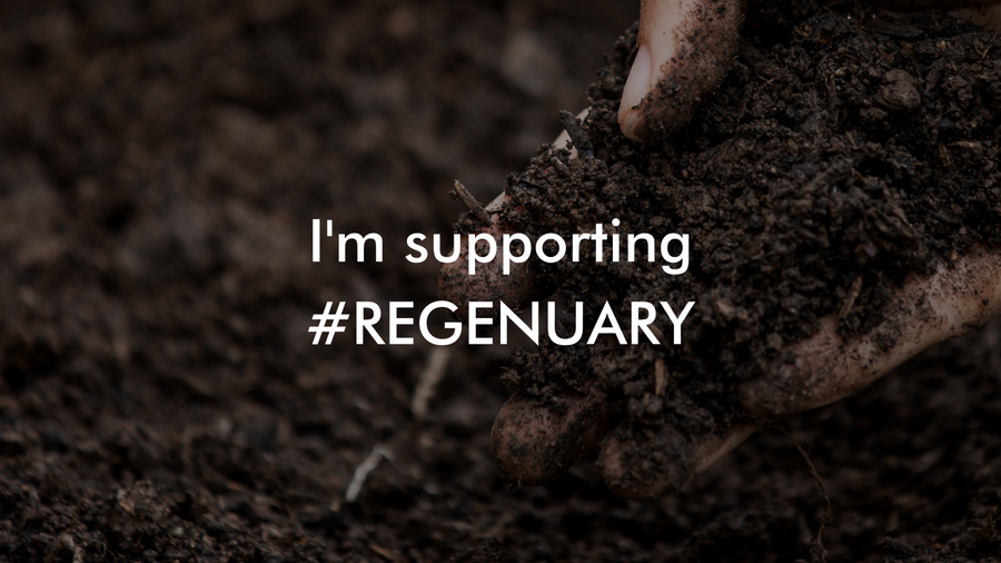 Hand in dark soil with the text "I'm supporting #Regenuary"