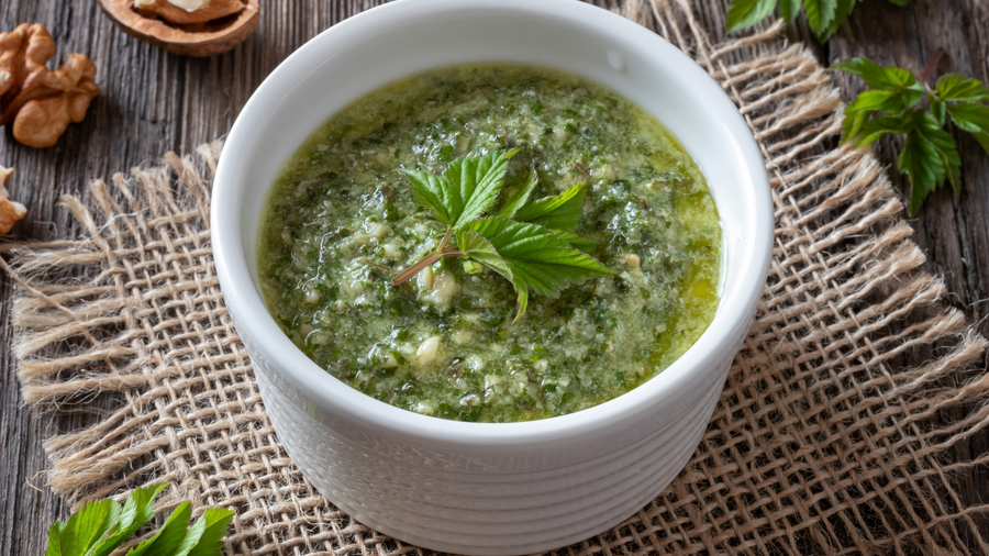 Bowl of green woodland soup on a hessian cloth